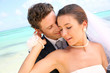 Couple celebrating wedding on the beach
