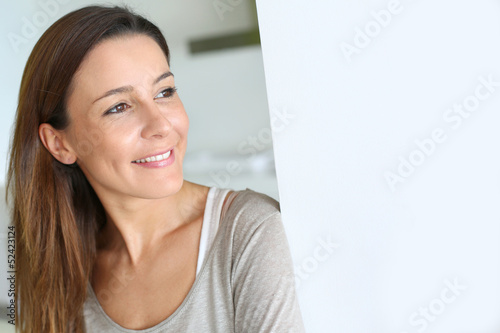 Photo: Beautiful brunette girl relaxing at home Beautiful brunette girl relaxing at home