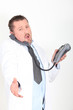 Photo: Doctor offering to shake hand whilst on the telephone Doctor offering to shake hand whilst on the telephone