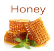 Photo: Sweet honeycombs with mint isolated on white Sweet honeycombs with mint isolated on white
