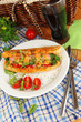 Delicious hot dog on plate at picnic close-up