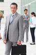 Man with briefcase outside office building