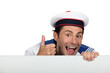 Foto: Silly sailor with a board Silly sailor with a board