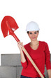 Photo: sexy craftswoman holding a shovel sexy craftswoman holding a shovel