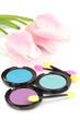 Bright eye shadows and sponge brushes for foundation close up