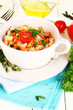 Delicious rice with vegetables and herbs in pot