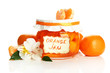 Orange jam with zest and tangerines, isolated on white
