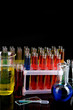 Colorful test tubes on dark background