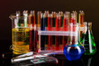Colorful test tubes on dark background