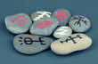 Fortune telling  with symbols on stones on grey background