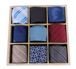 Neckties in wooden box isolated on white