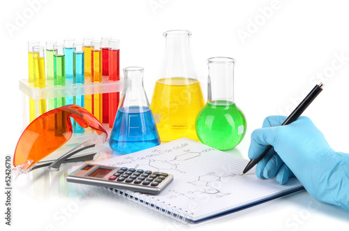 Photo: Hand scientist writing formulas isolated on white Hand scientist writing formulas isolated on white