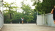 girl running in the morning, followed by the running man