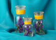 Flowering branches in glass banks blue fabric background