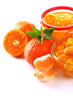 Orange jam with zest and tangerines, isolated on white