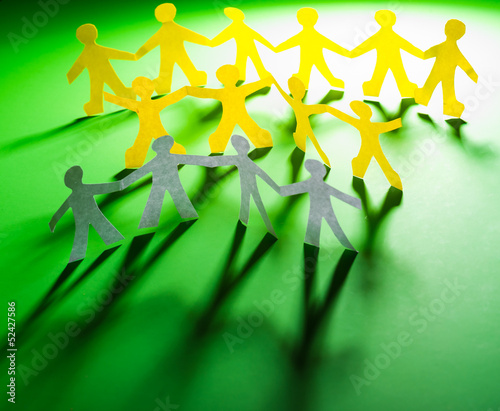 Photo: Paper people in teamworking concept Paper people in teamworking concept
