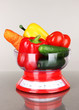 Fresh vegetables in scales on gray background
