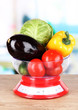 Fresh vegetables in scales on table in kitchen