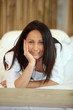 Photo: Woman lying on her bed Woman lying on her bed