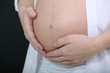 Close-up of pregnant belly
