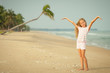 Adorable happy smiling girl on beach vacation