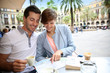 Couple in Barcelona sitting at restaurant table in Plaza Real