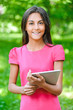 Foto: dark-haired young woman with e-book dark-haired young woman with e-book