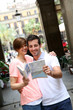 Tourists standing near the Plaza real of Barcelona