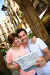 Tourists standing near the Plaza real of Barcelona