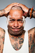 Stylish African American Man Holding Head In Frustration