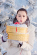 girl with gift in winter park