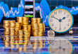 Stacks of golden coins, clock, dices cube with the words SELL. T