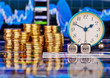 Stacks of golden coins, clock, dices cubes with the words SELL B