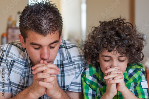 Photo: Brothers praying at home Brothers praying at home
