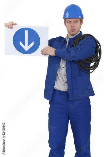 Photo: Menacing traffic guard holding a sign Menacing traffic guard holding a sign