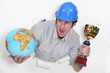 Photo: Laborer with globe and cup in hands Laborer with globe and cup in hands