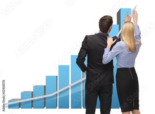 Photo: man and woman working with 3d graphics man and woman working with 3d graphics