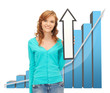 Photo: girl with big 3d chart holding arrow sign girl with big 3d chart holding arrow sign
