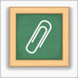 Blackboard with icon of a paper clip