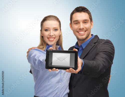 Photo: man and woman with tablet pc man and woman with tablet pc