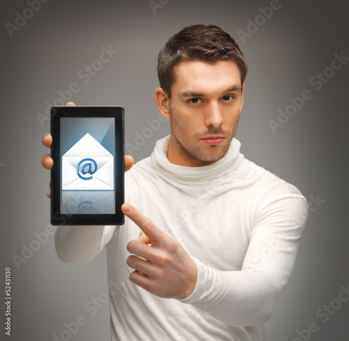 Photo: man pointing at tablet pc with email icon man pointing at tablet pc with email icon