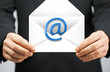 man in suit holding envelope with email sign