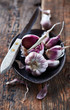 Garlic bulbs and cloves in a ceramic dish
