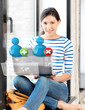 Photo: girl with laptop and contact icons girl with laptop and contact icons