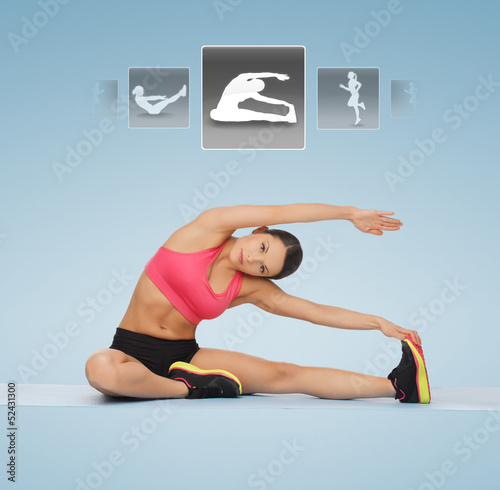Photo: woman stretching on the floor woman stretching on the floor