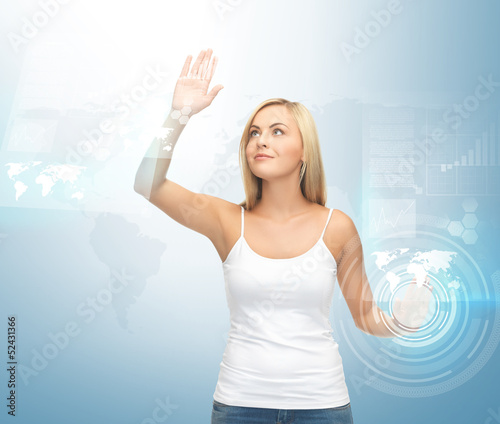 Photo: woman working with virtual screen woman working with virtual screen