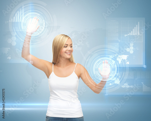 Photo: woman working with virtual screen woman working with virtual screen