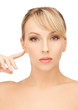 woman touching her ear