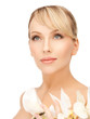 woman with white orchid flower
