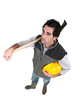 Workers with helmet in hand